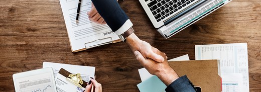 Business People Shaking Hands Together